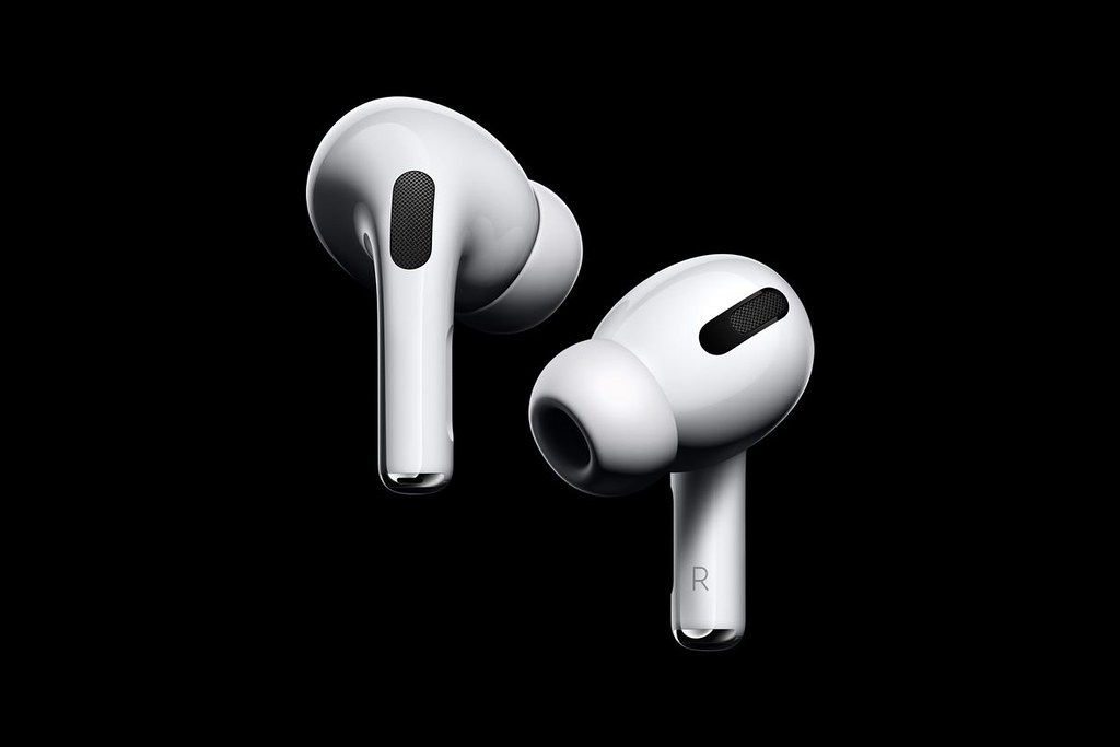 Wireless earbuds on a dark surface